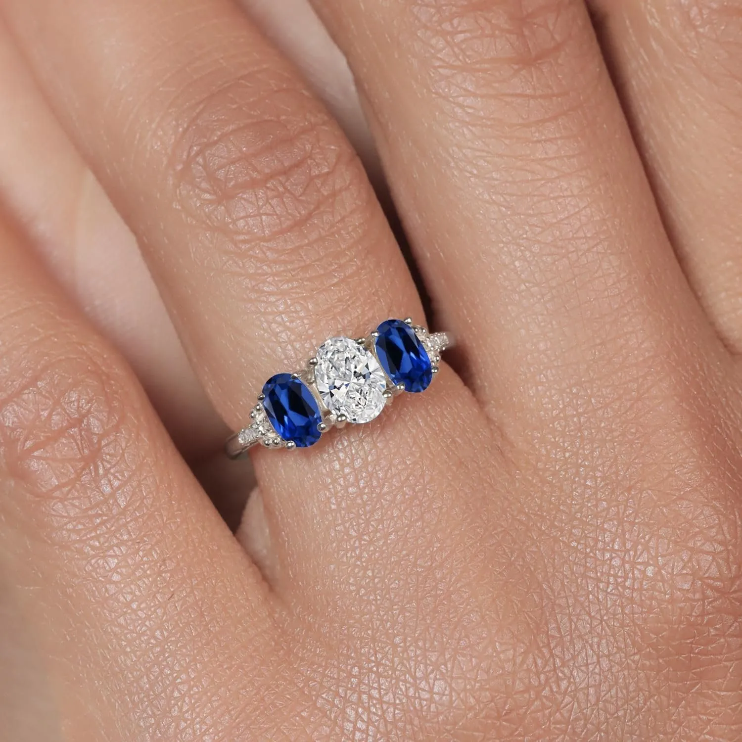 Gem Stone King 2.22 Cttw 10K White Gold IGI Certified Lab Grown Diamond and Blue Created Sapphire 3-Stone Engagement Ring | Center Oval Diamond 1.00 Ct | E-F Color | VS1-VS2 Clarity | Size 5,6,7,8,9